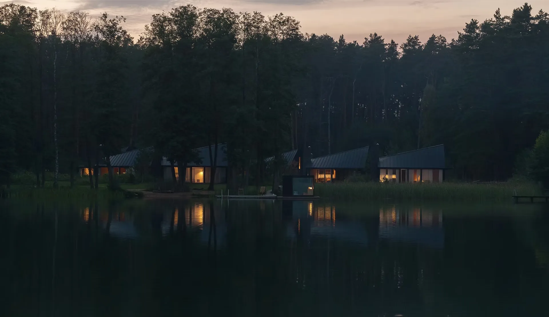 Konga Village cabins by the lake at dusk